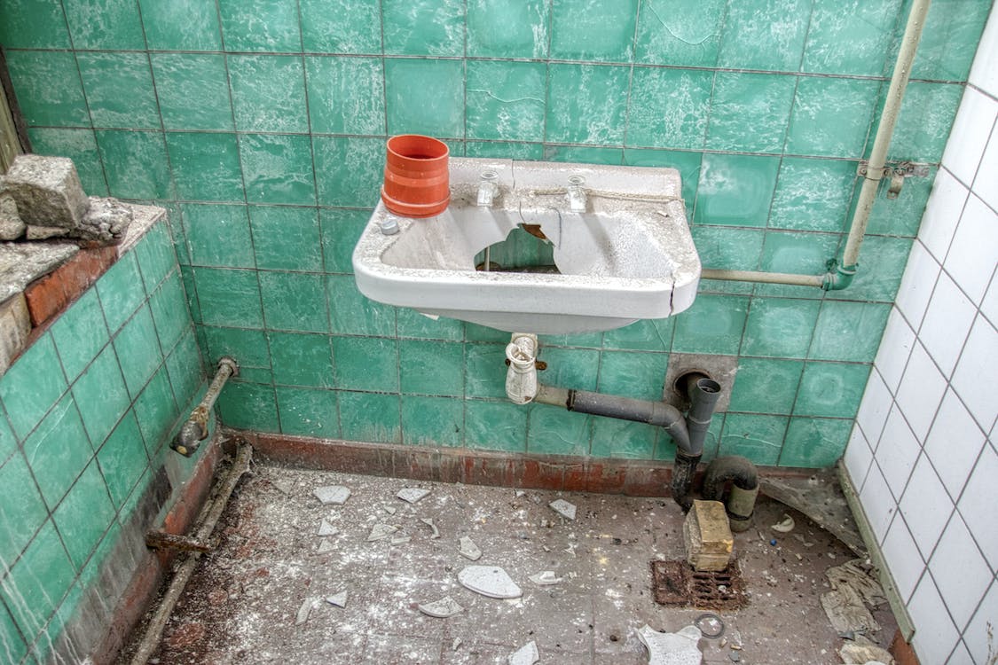 Free Demolished Lavatory with Rusty Pipes Stock Photo