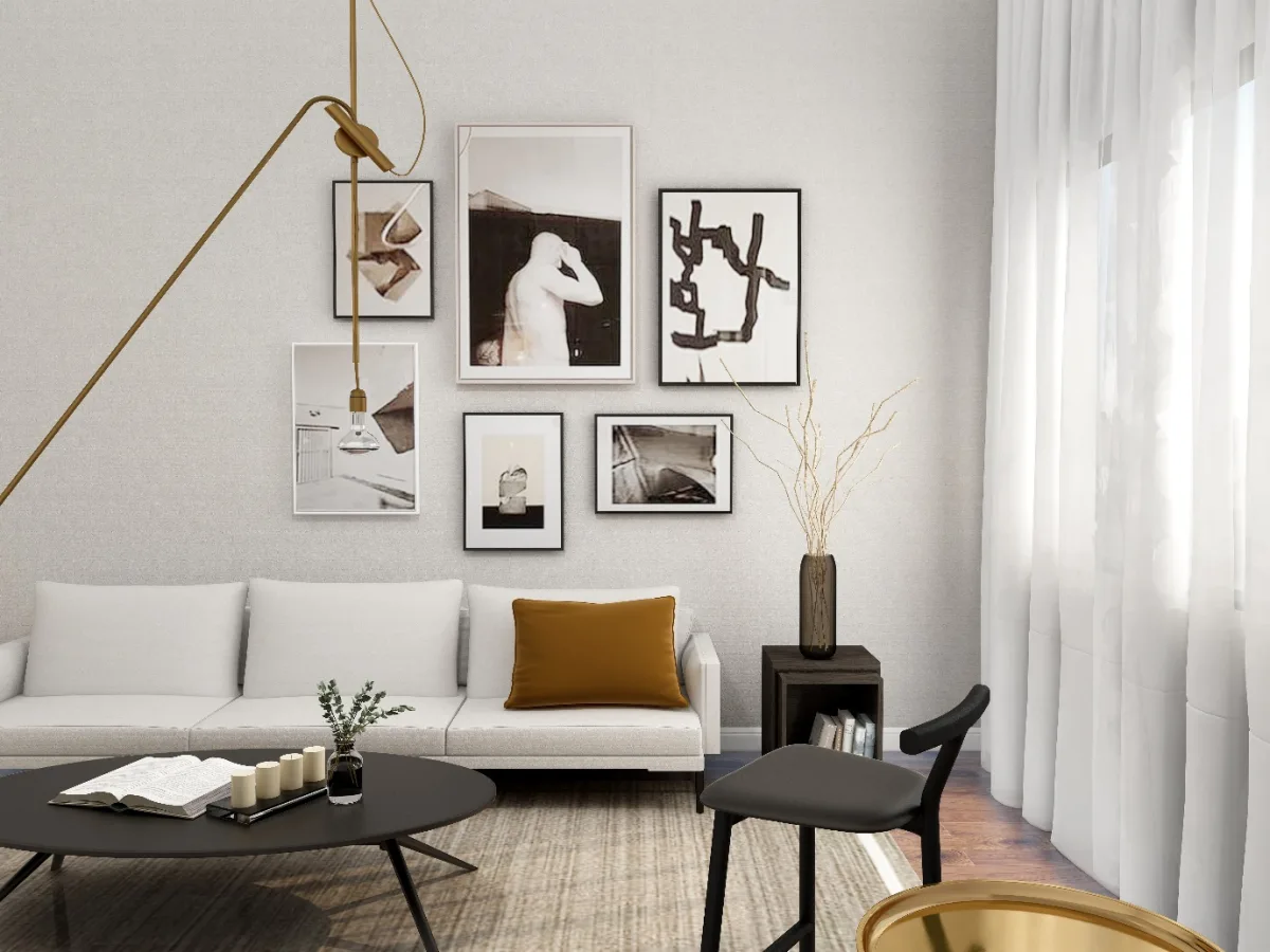 A living room with a couch and pictures on the wall
Description automatically generated
